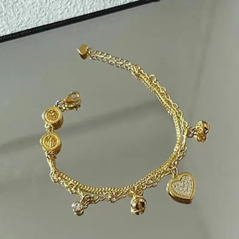 Gold Layered Heart With Bell Charms Bracelet